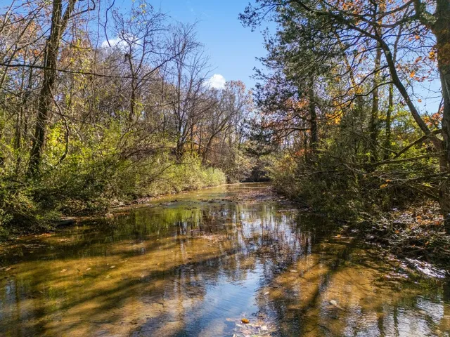 a view of residential houses with yard