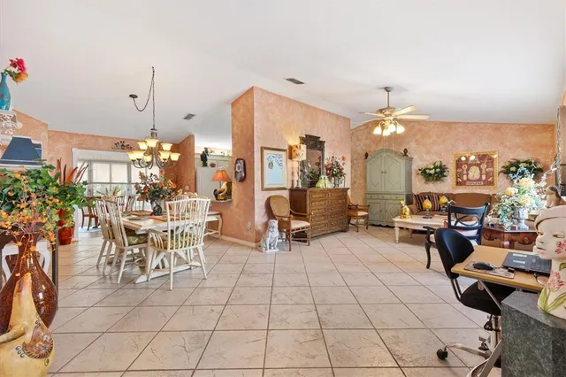 a living room with lots of furniture and a chandelier