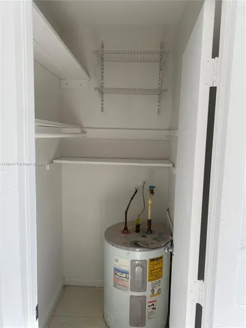 a view of storage and utility room with washer and dryer