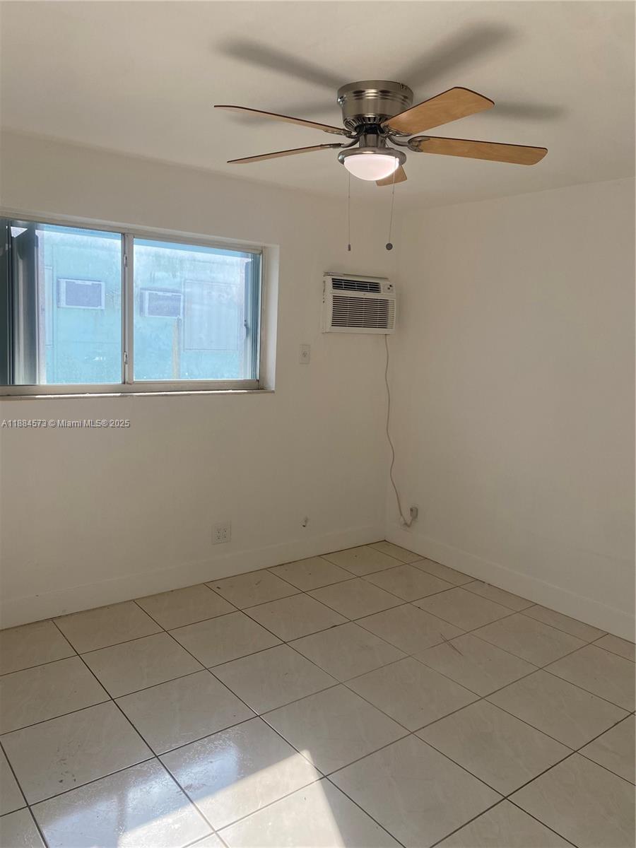 479 Southwest 3rd Street, Unit 9 Miami, FL 33130 - Photo 4 of 4 an empty room with a window