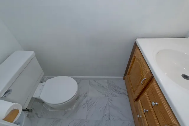 a bathroom with a toilet and sink