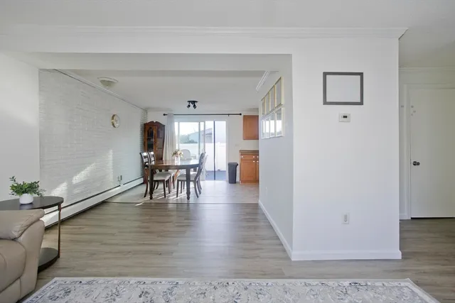 a view of a livingroom with furniture and hardwood floor