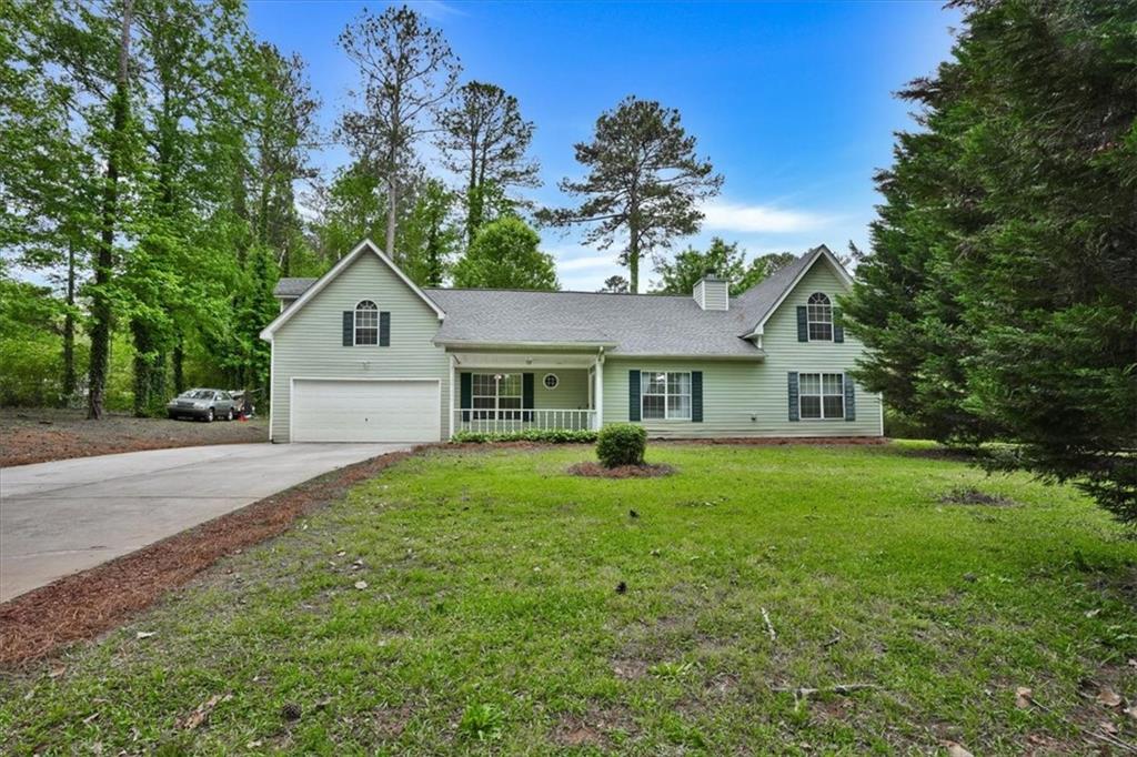 40 Flakes Road Stockbridge, GA 30281 - Photo 1 of 1 a front view of a house with a yard and trees