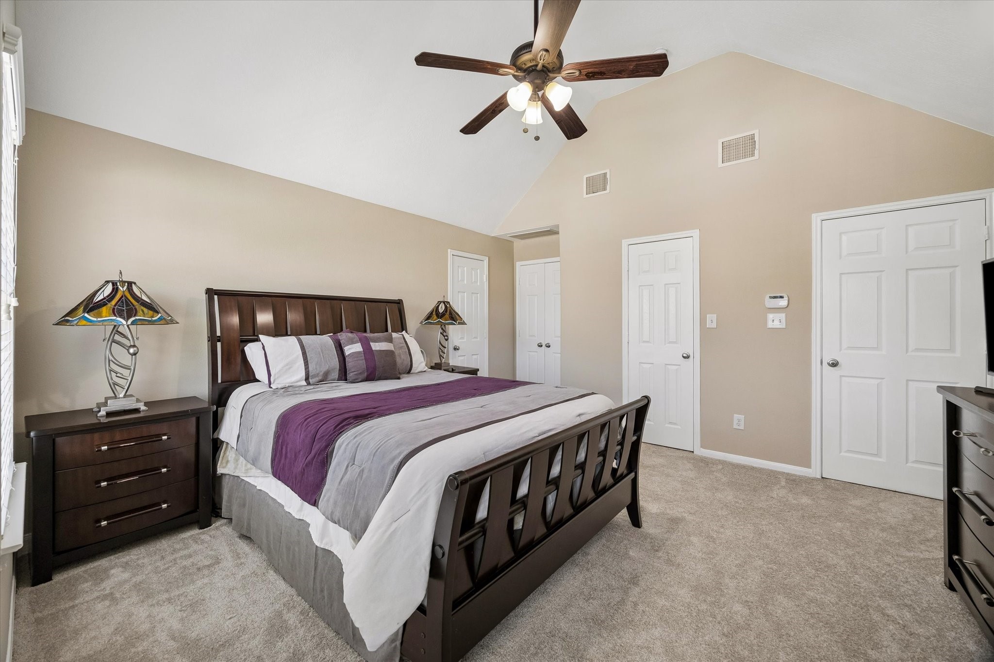 8433 Sunset Loch Drive Spring, TX 77379 - Photo 16 of 25 a bedroom with a bed and a ceiling fan