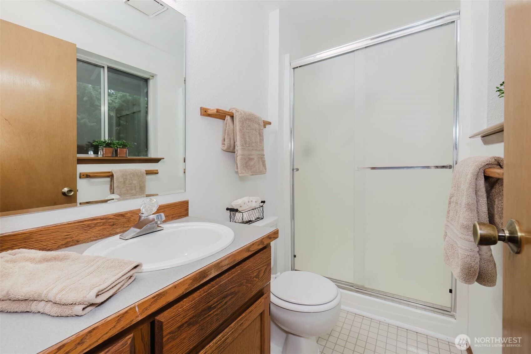 3303 Northwest Half Mile Road Silverdale, WA 98383 - Photo 15 of 33 a bathroom with a sink and a mirror