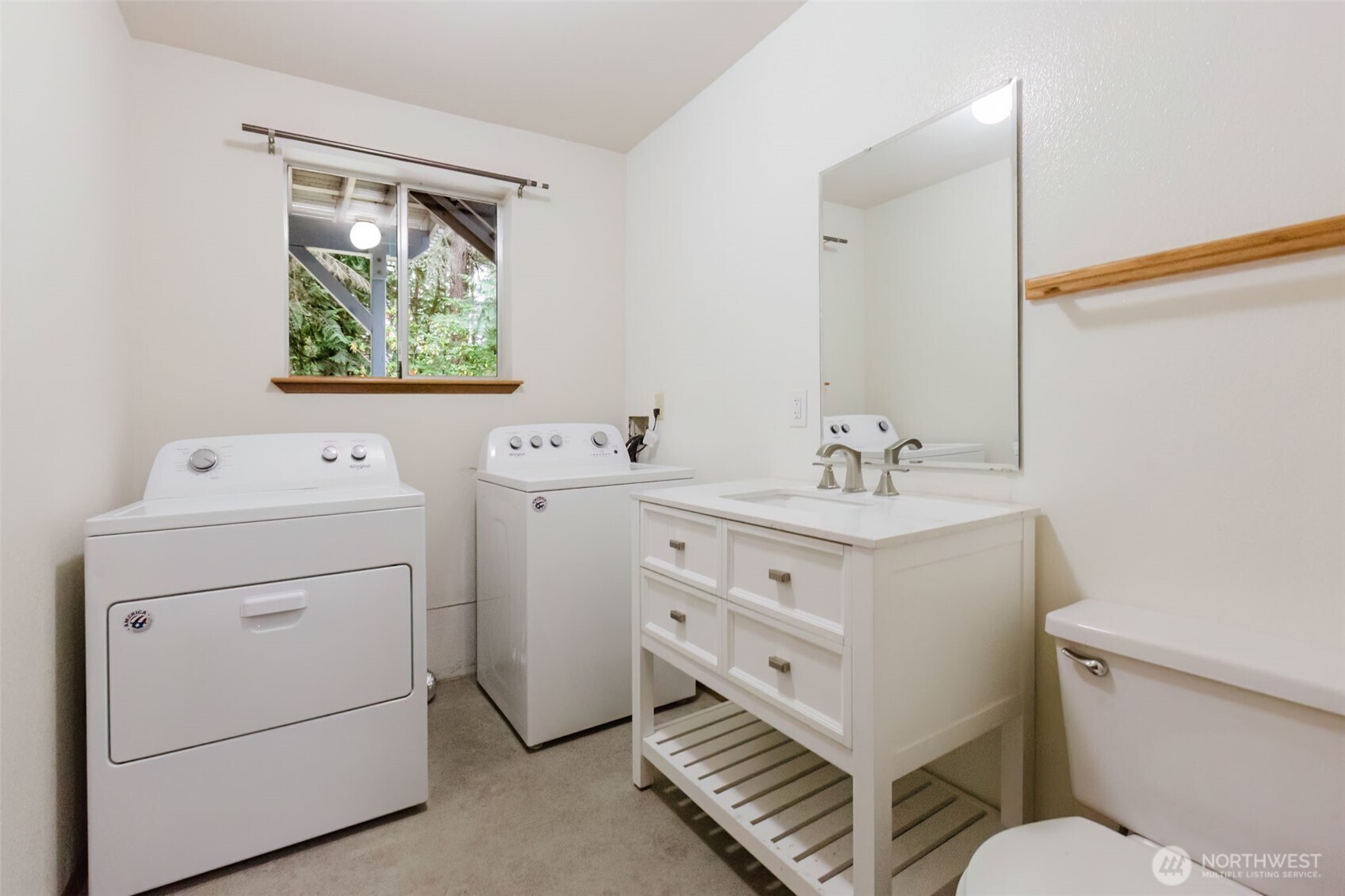 3303 Northwest Half Mile Road Silverdale, WA 98383 - Photo 17 of 33 a bathroom with a sink toilet vanity and mirror