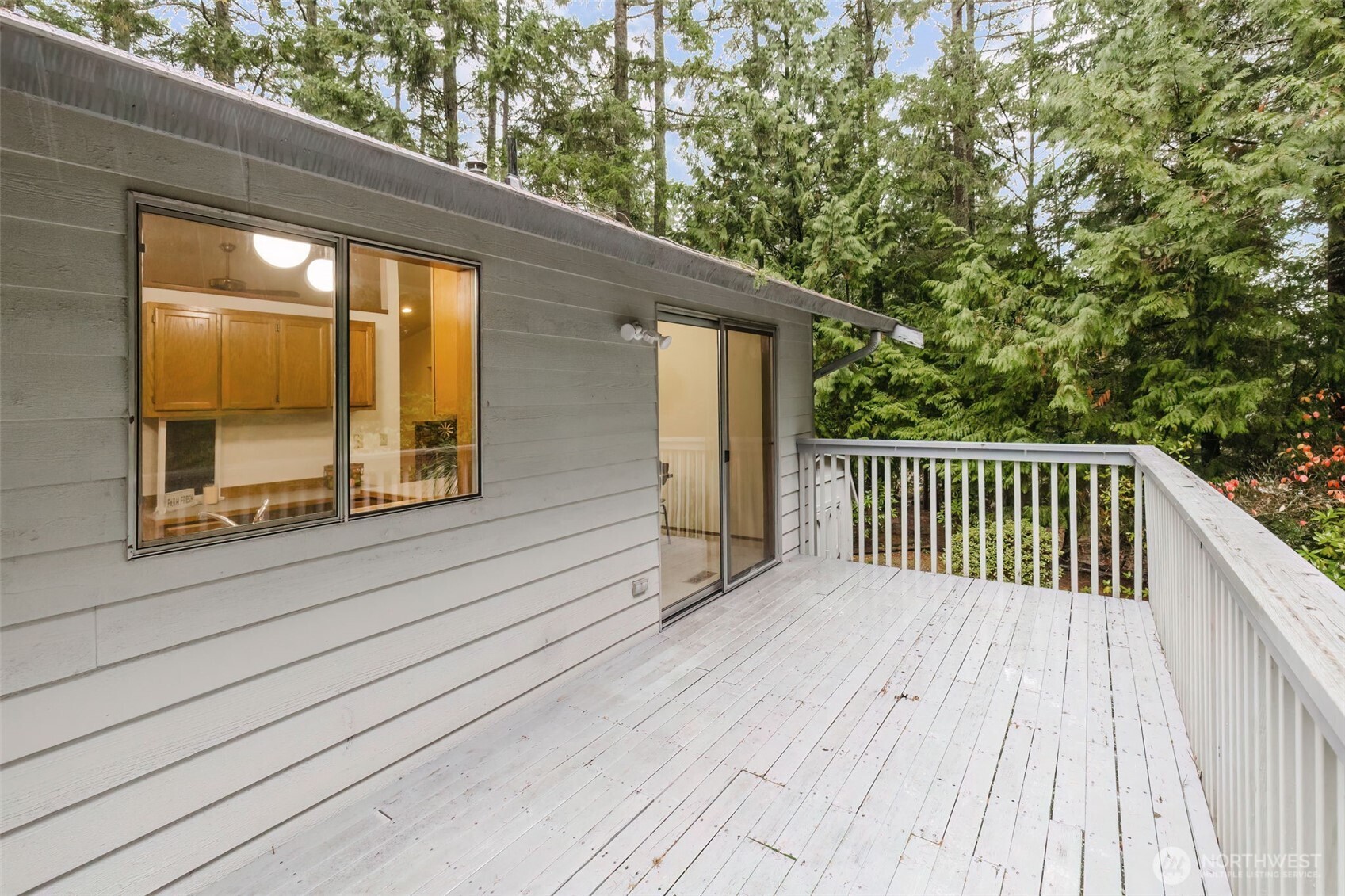 3303 Northwest Half Mile Road Silverdale, WA 98383 - Photo 18 of 33 a view of backyard with a deck and wooden floor
