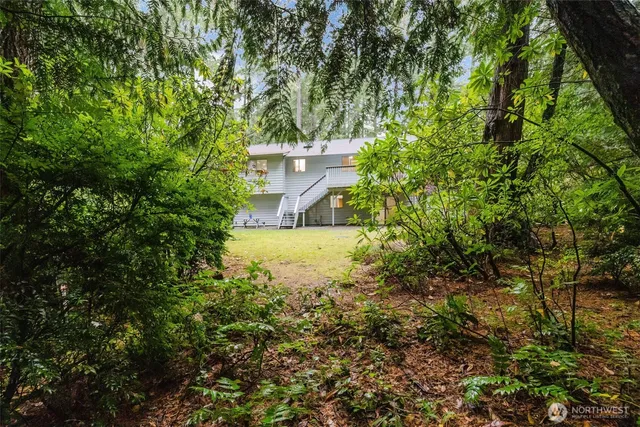 a view of a house with a snow in the yard