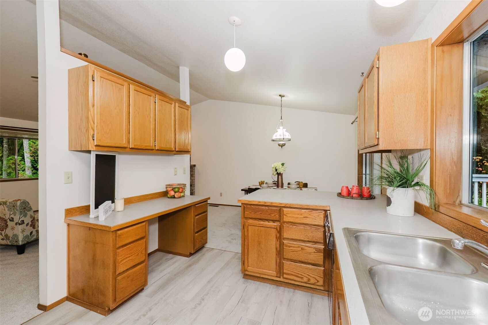 3303 Northwest Half Mile Road Silverdale, WA 98383 - Photo 9 of 33 a kitchen with stainless steel appliances granite countertop a sink stove and wooden cabinets