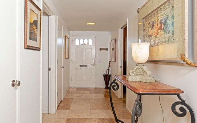 a view of a hallway with bathroom