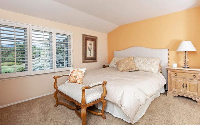 a bedroom with a bed and a night stand