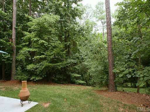 2329 Primrose Valley Court Raleigh, NC 27613 - Photo 11 of 12 A view of the woods can be enjoyed from the back yard deck and patios. Exterior Back