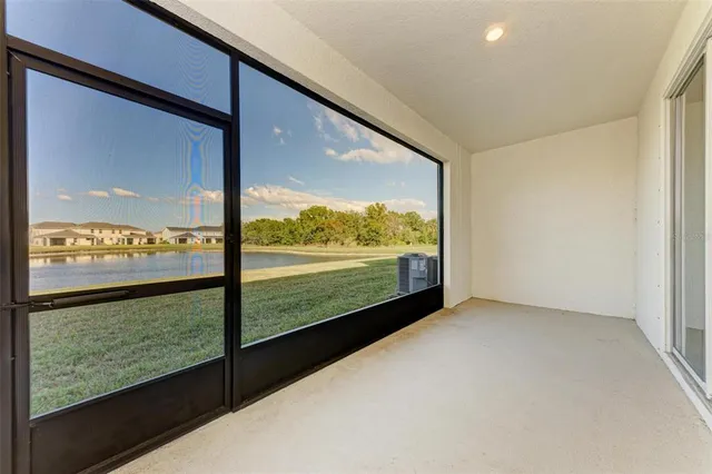 a view of a lake with houses in the background