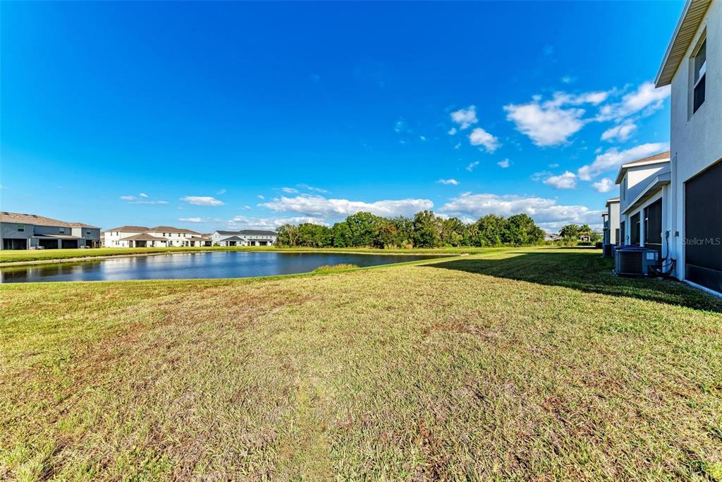 11427 Planetree Place Bradenton, FL 34211 - Photo 17 of 28 a view of a lake with houses in the background