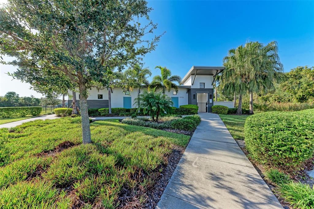 11427 Planetree Place Bradenton, FL 34211 - Photo 18 of 28 a front view of a house with a yard