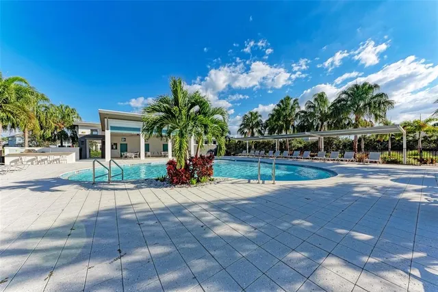 a view of swimming pool from a lounge chair