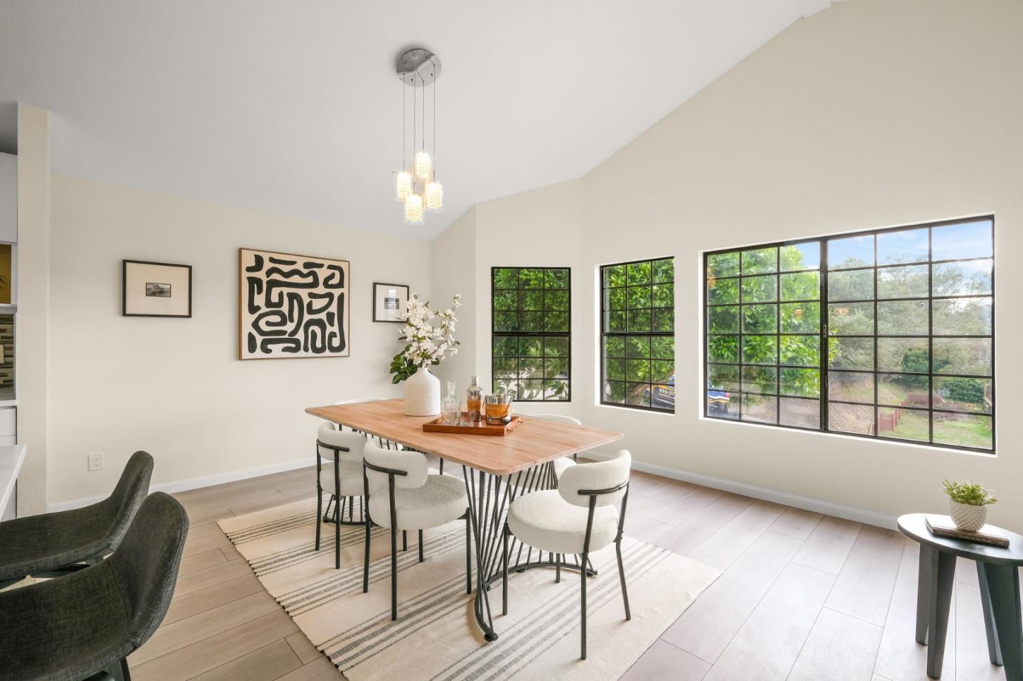 415 C Street Colma, CA 94014 - Photo 16 of 45 a view of a dining room with furniture large windows and wooden floor