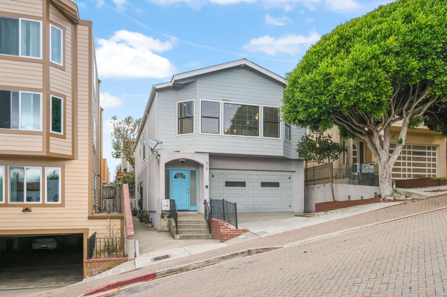 415 C Street Colma, CA 94014 - Photo 3 of 45 a view of a house with a parking area