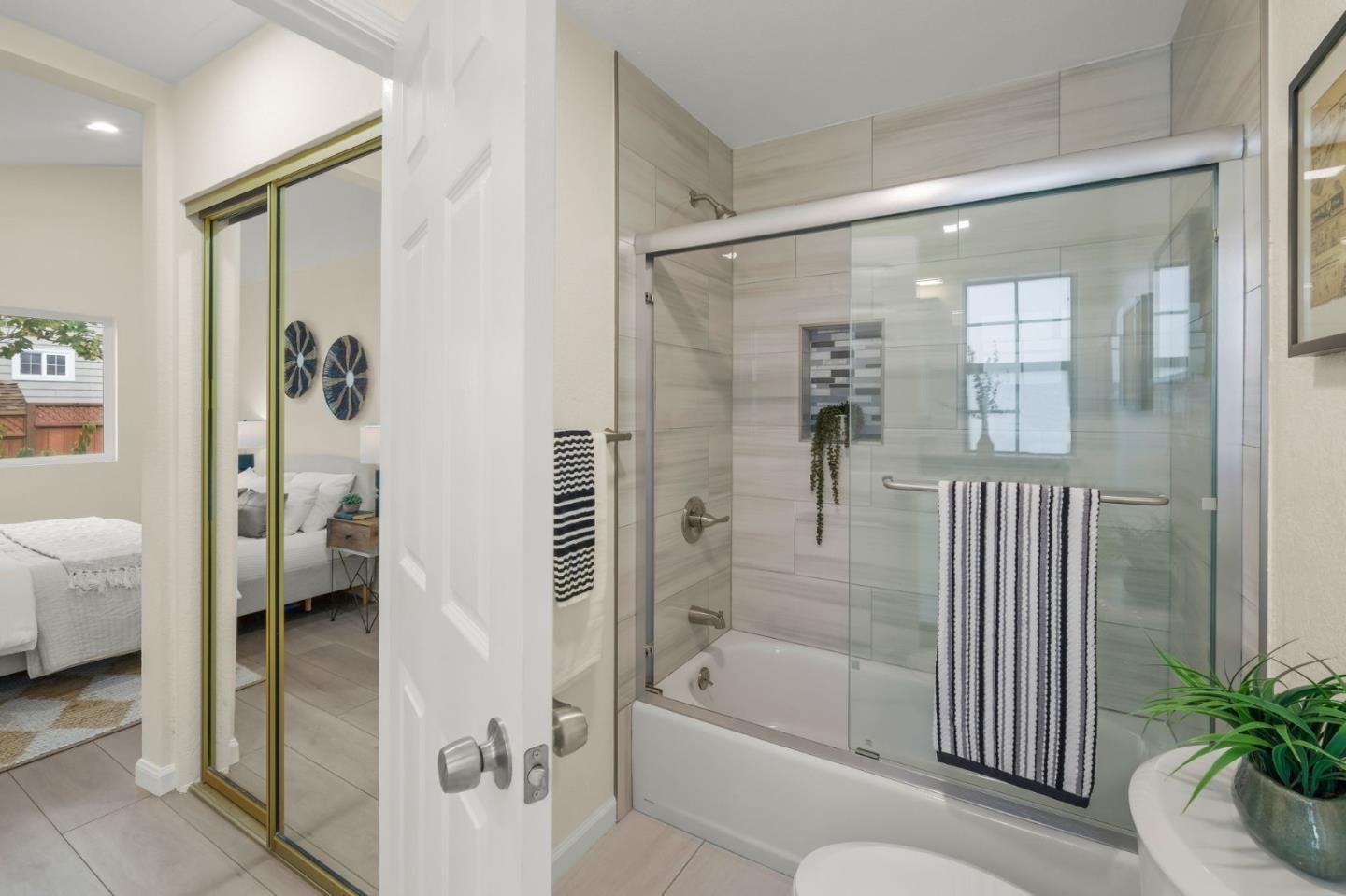 415 C Street Colma, CA 94014 - Photo 31 of 45 a en suite bathroom with a bathtub and a shower