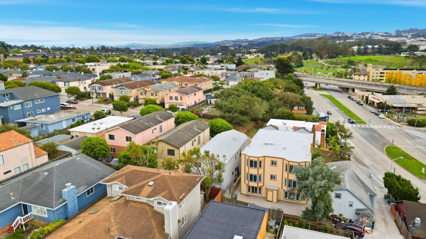 415 C Street Colma, CA 94014 - Photo 39 of 45 an aerial view of residential building with parking