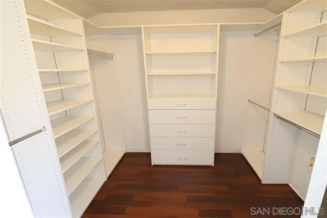 a front view of a house with a yard and a garage