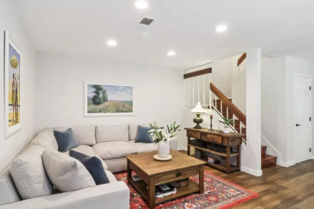 a backyard of a house with a garden and outdoor seating