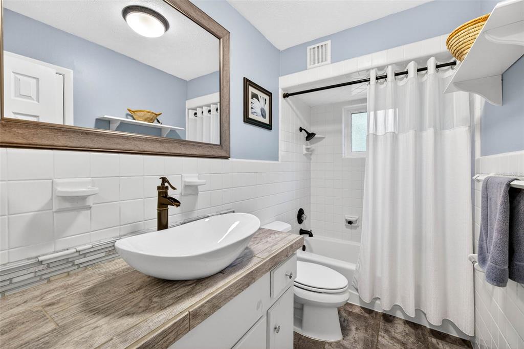 16330 Hanna Road Lutz, FL 33549 - Photo 19 of 41 a bathroom with a sink and a toilet