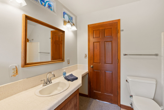 435 Canyon Road Millville, UT 84326 - Photo 32 of 113 Bathroom vanity with a tiled countertop and integrated sink