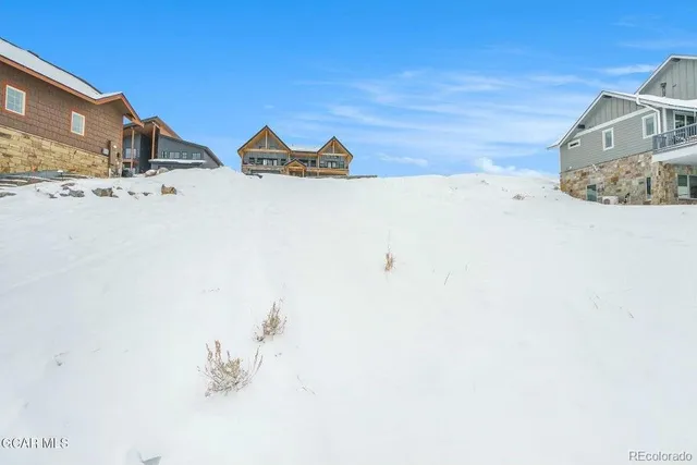 a view of wooden fence in front of house