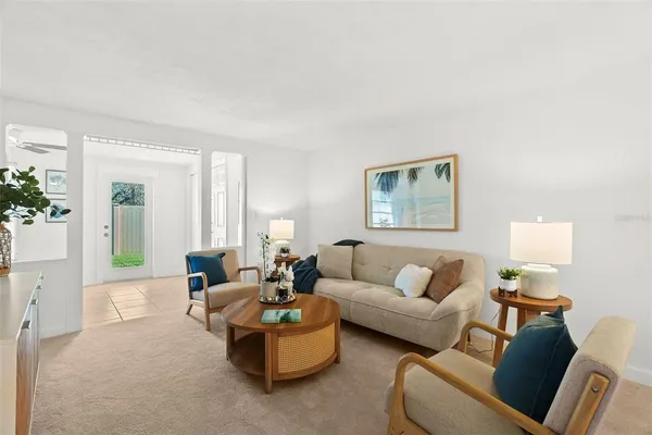 a living room with furniture and a large window