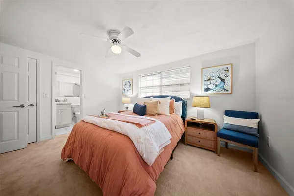 a bed room with a bed and a chandelier