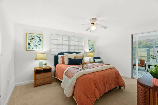 a bedroom with a bed and window