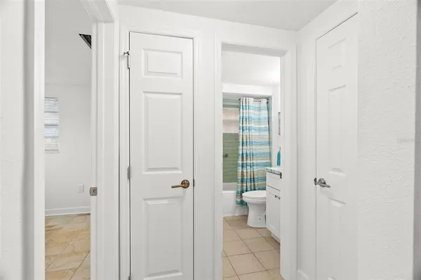 a bathroom with white walls