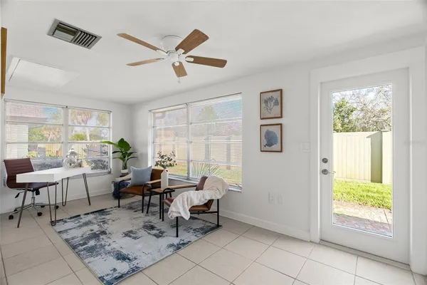 a living room with furniture and a window