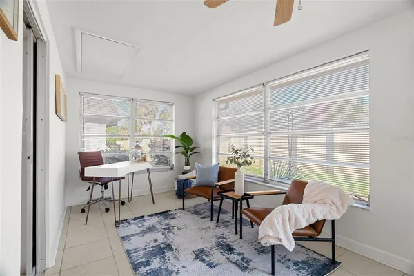 a living room with furniture and a window