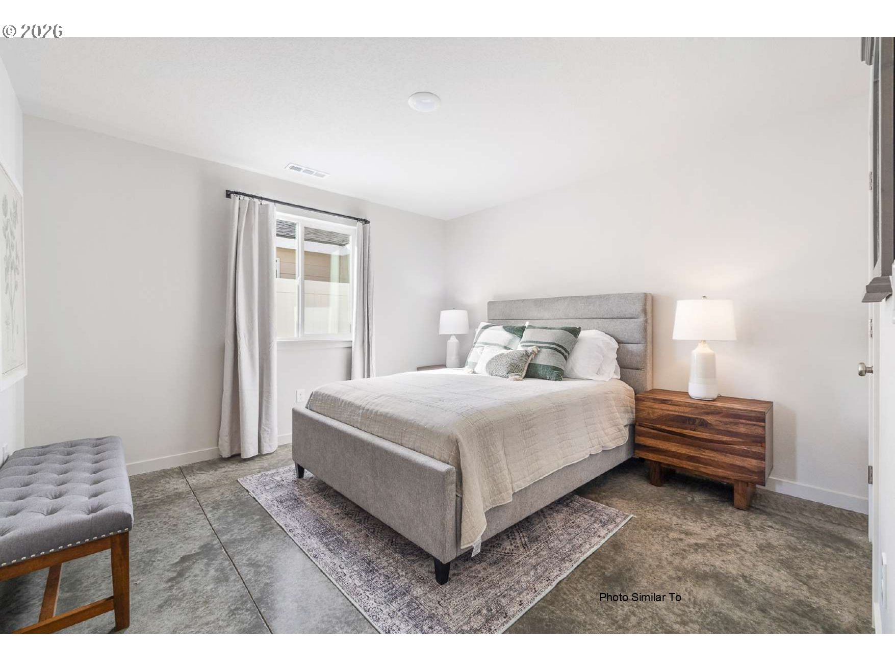 605 Jimmy Street Stanfield, OR 97875 - Photo 4 of 10 a bedroom with a bed and a night stand