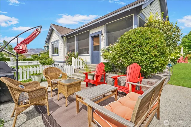 a view of a patio with table and chairs and potted plants