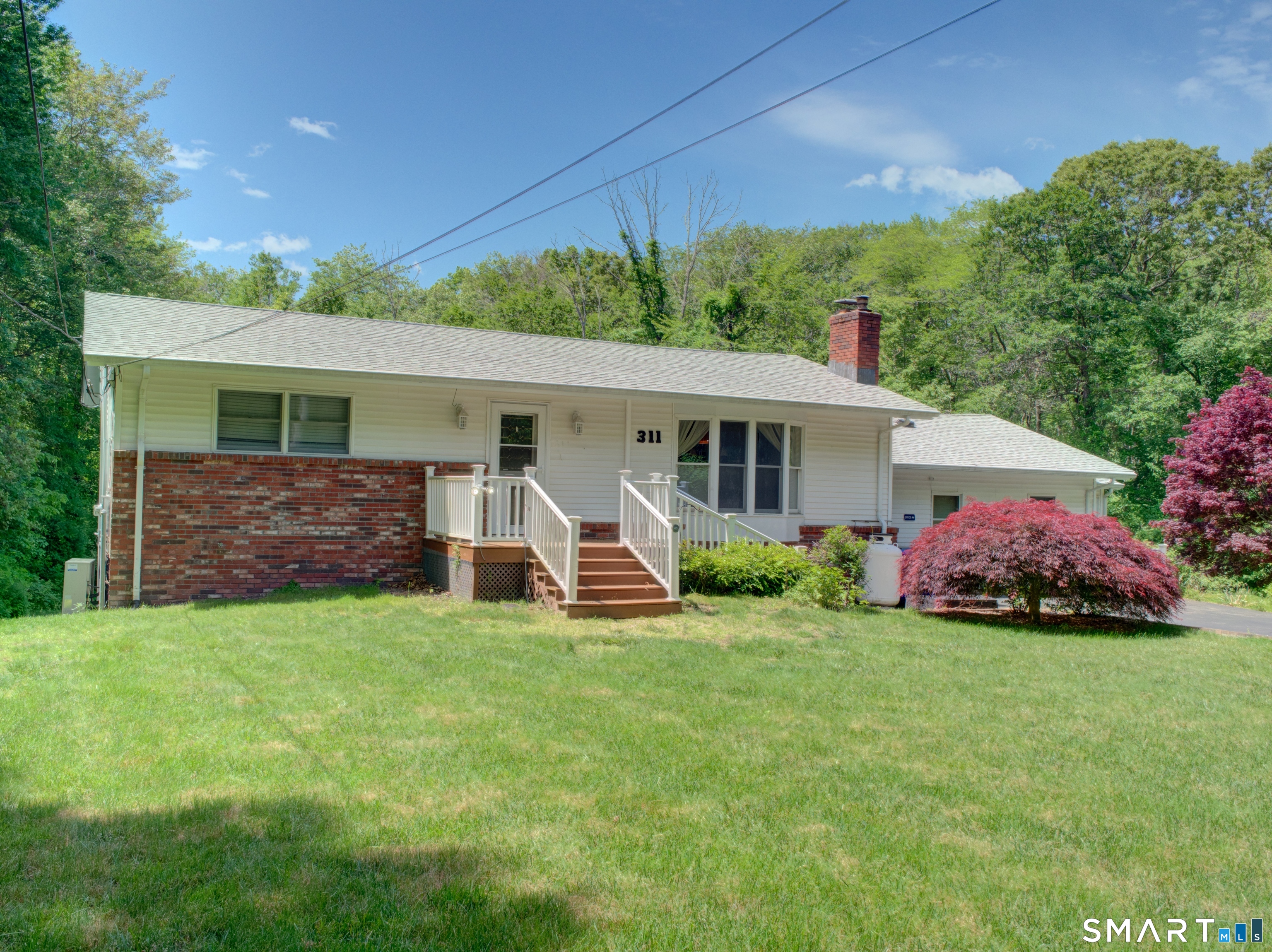 311 Sandy Hollow Road Groton, CT 06355 - Photo 1 of 26 a view of a house with a yard and sitting area