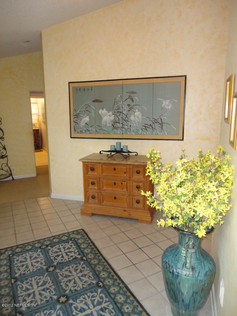 875 Waterman Road North Jacksonville, FL 32207 - Photo 14 of 27 a vase of flowers sitting on a table