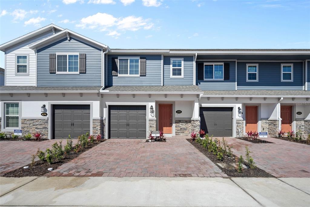 a front view of a house with yard