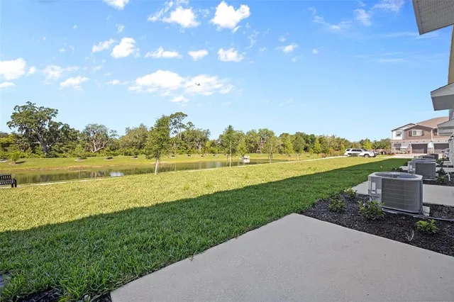 a view of a lake with a big yard
