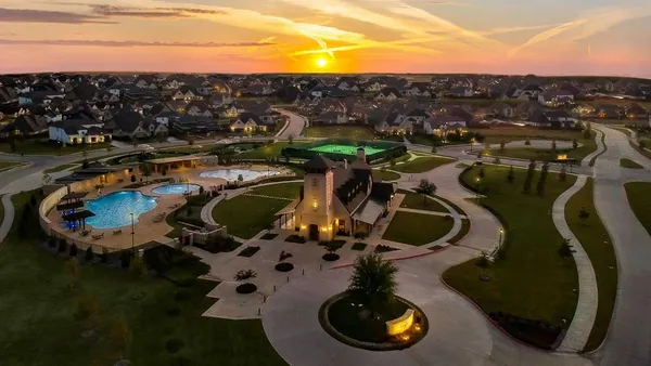 a view of a swimming pool with lawn chairs