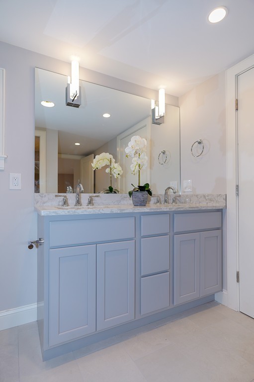 75 Decatur Street, Unit 3 Arlington, MA 02474 - Photo 14 of 20 a spacious bathroom with a granite countertop sink a mirror and a vanity