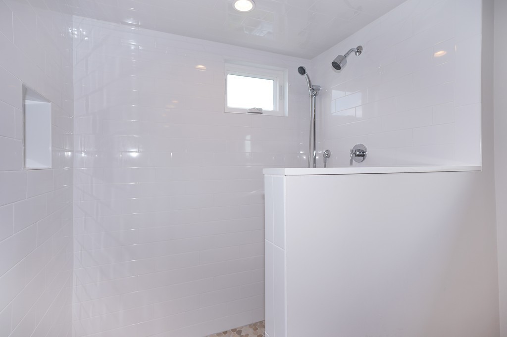 75 Decatur Street, Unit 3 Arlington, MA 02474 - Photo 15 of 20 a bathroom with a sink a mirror and a shower