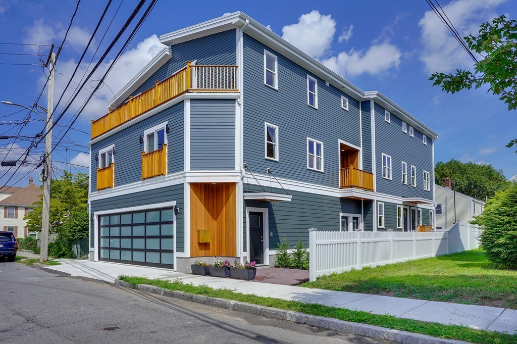 75 Decatur Street, Unit 3 Arlington, MA 02474 - Photo 20 of 20 a front view of a house with a garden and plants