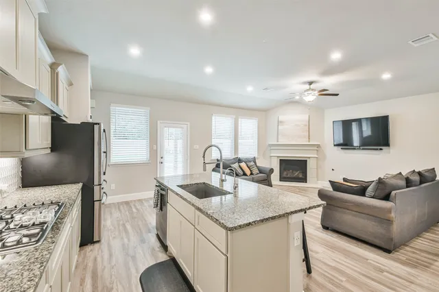 a living room with furniture and a fireplace