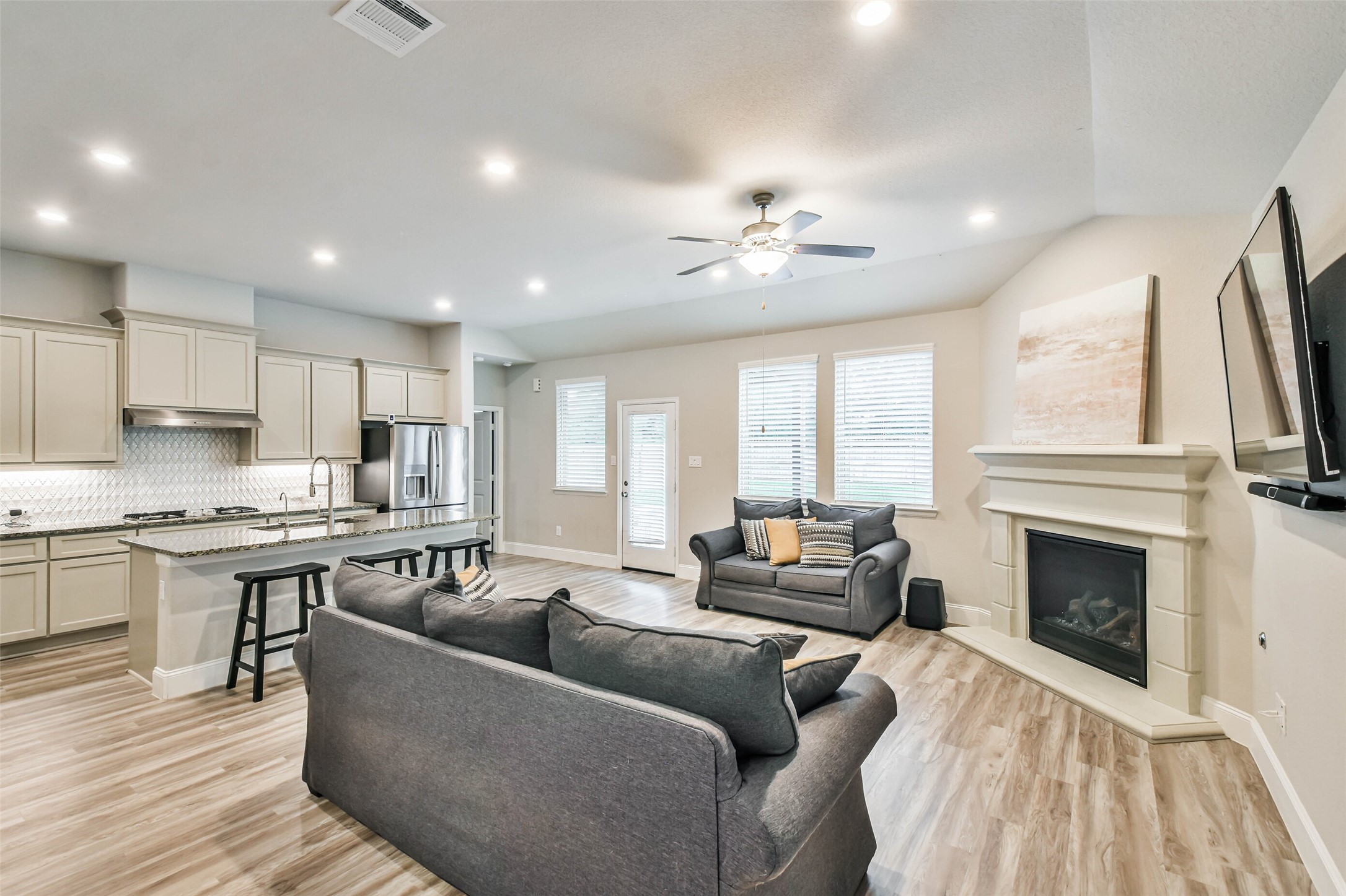 22095 Volante Drive Spring, TX 77386 - Photo 15 of 47 a living room with furniture wooden floor and a fireplace