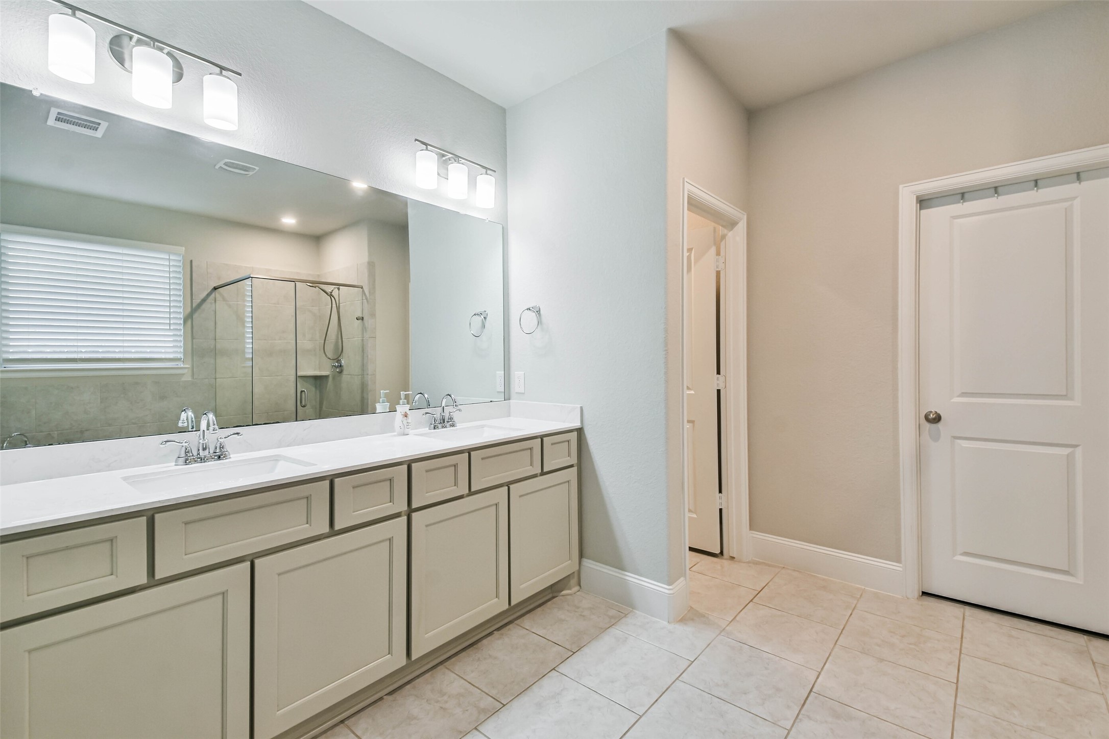 22095 Volante Drive Spring, TX 77386 - Photo 25 of 47 a bathroom with a sink and a mirror