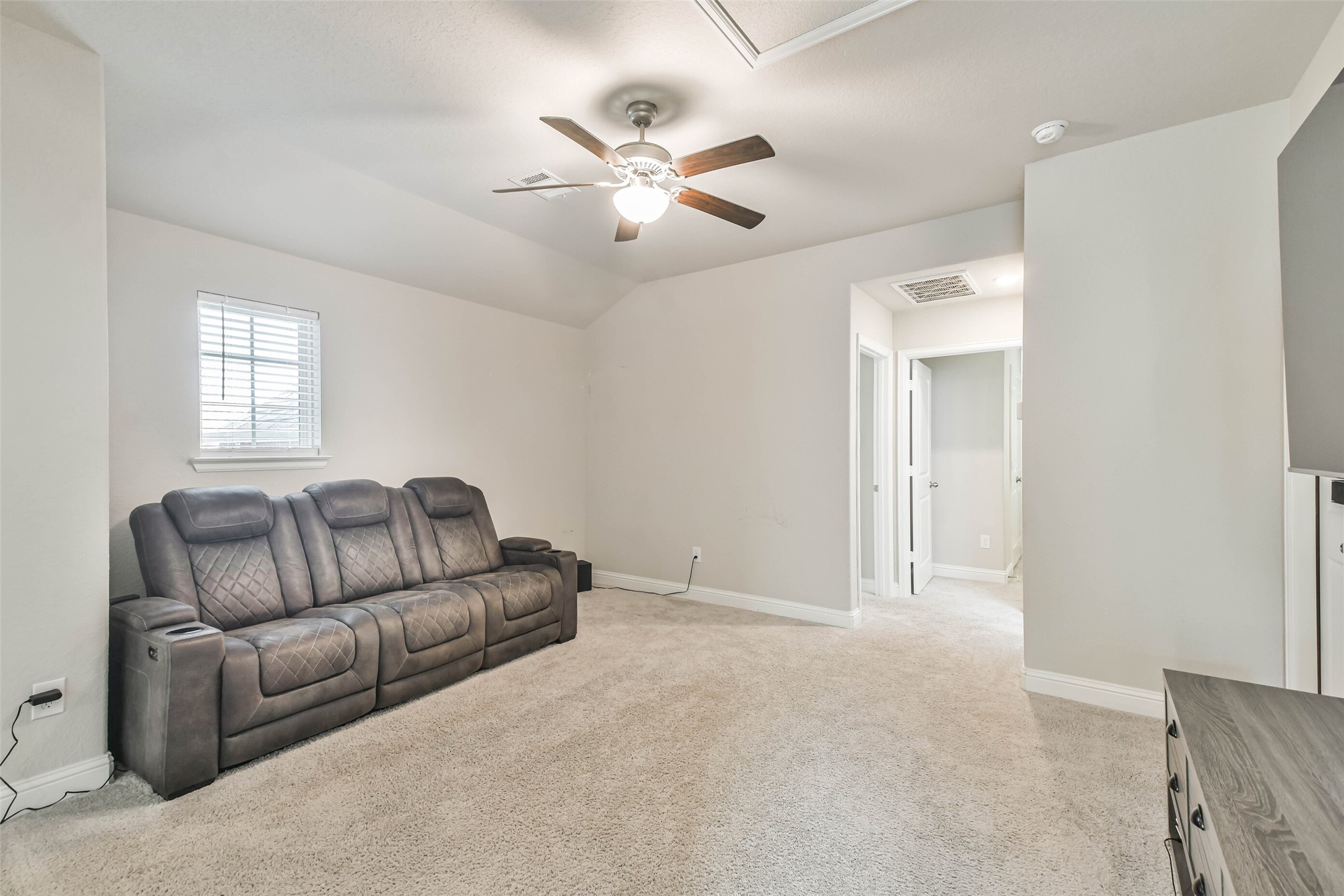 22095 Volante Drive Spring, TX 77386 - Photo 28 of 47 a living room with furniture and a ceiling fan