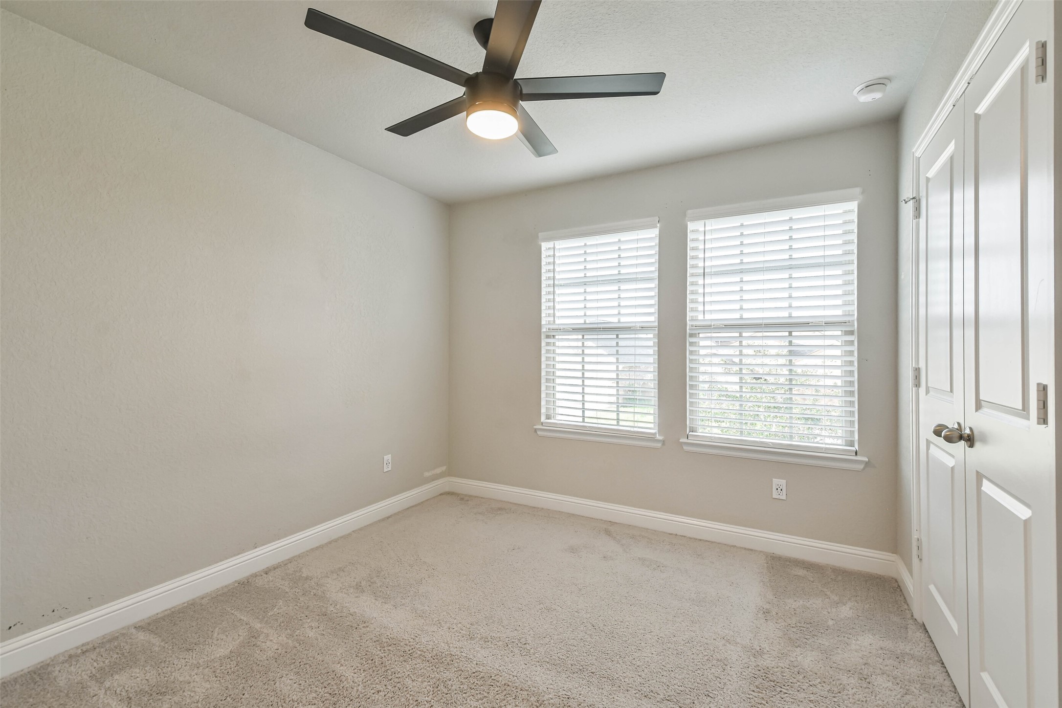 22095 Volante Drive Spring, TX 77386 - Photo 32 of 47 an empty room with a window and a fan